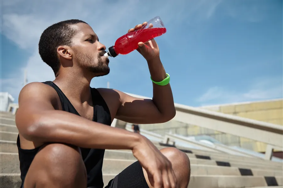 Man drinking a sports beverage